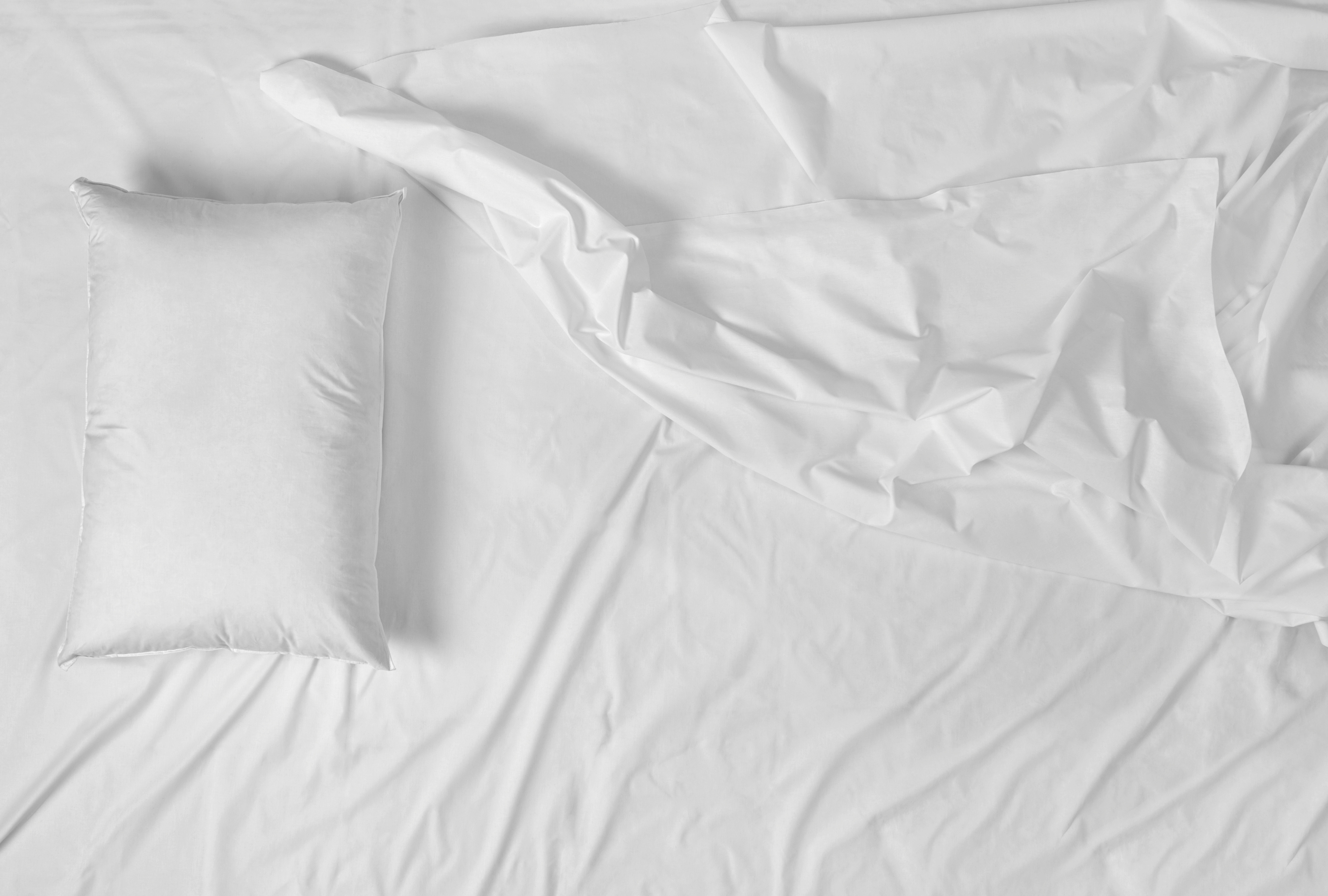 White sheets with a pillow