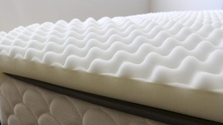 closeup of an egg crate foam mattress topper