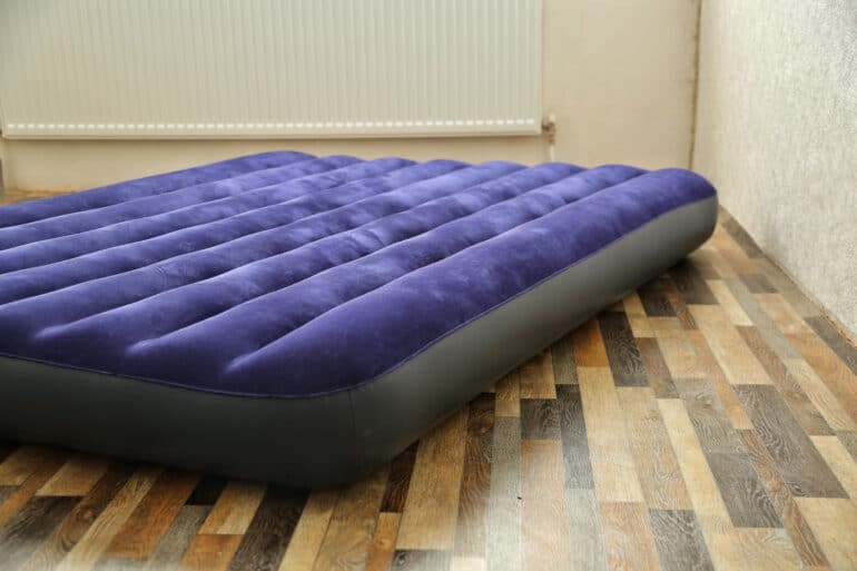 air mattress on a vinyl floor