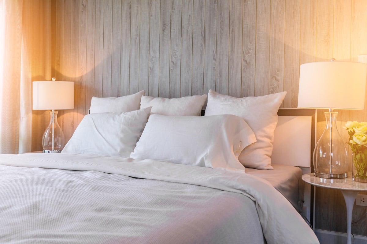 Bed maid-up with clean white pillows and bed sheets