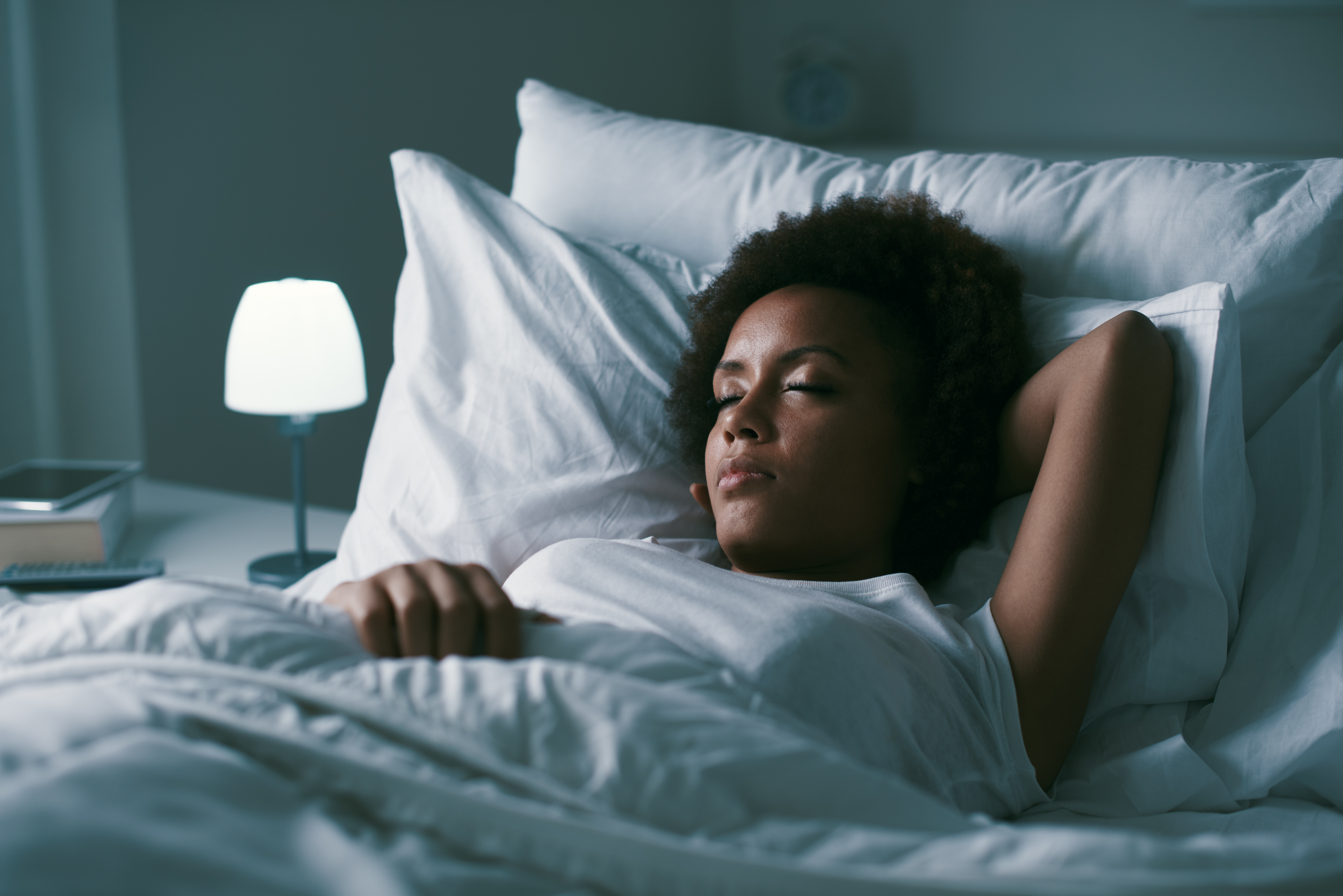 African American woman asleep in bed