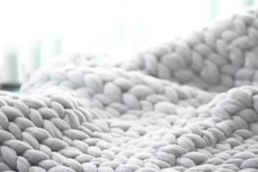 closeup of white knit blanket
