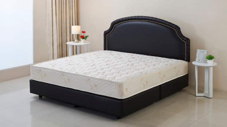 mattress on black bedframe